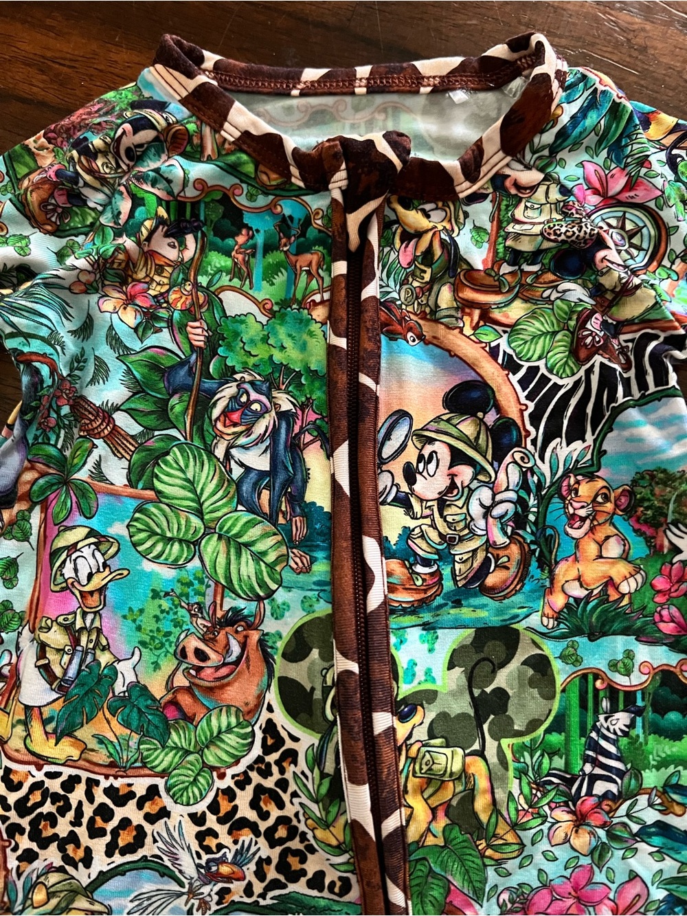 Sugar Swan-6-12 zippy Safari Print. Used in great condition.